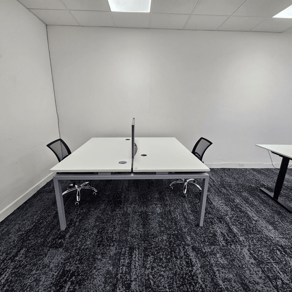 Method Spaces Office Unit 1A-101 offers five desks, high ceilings, natural light from large windows, renovated bathrooms, and street view of Portland, Manchester.