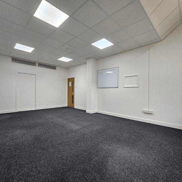 For rent: Method Spaces Unit 114, a bright serviced office with 5 desks, high ceilings, and natural light on Portland Street, Manchester.