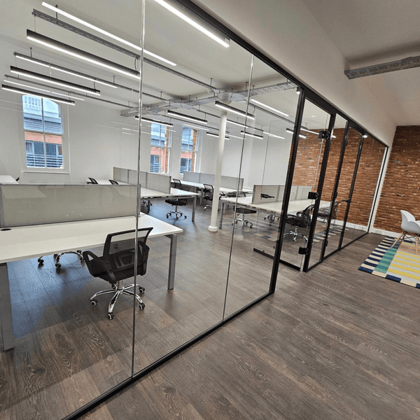 Unit 309 offers a modern office space on the 3rd floor, featuring 16 desks with natural light and amenities for productivity.