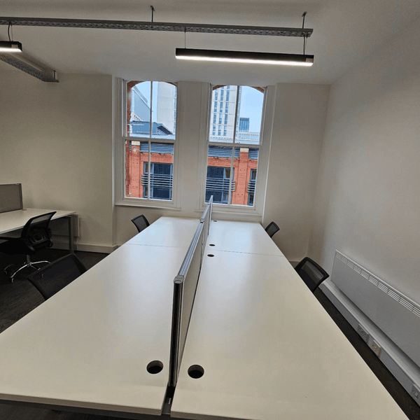 Serviced office at Method Spaces Unit 309 features 16 desks, natural light, a kitchen, and a common area for collaboration.