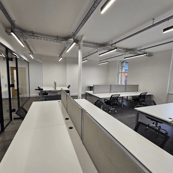 Bright and stylish office unit 309, 3rd floor of 109 Portland St, Manchester, with 16 desks, modern facilities, and a meditation room.