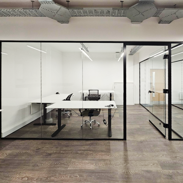 Spacious serviced office in Manchester featuring 3 desks, with optimal lighting, renovated bathrooms, common area, and high-speed internet.