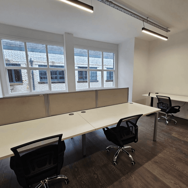 Method Spaces Unit 311 features seven desks in a bright, stylish office with high ceilings, expansive windows, and modern amenities. Located at Portland Plaza, Portland St. Manchester