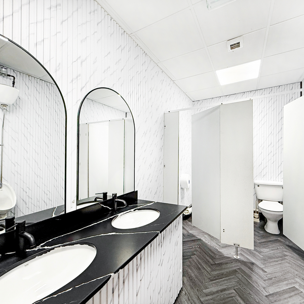 A bright and spotless bathroom in a serviced office, equipped with modern amenities and a fresh atmosphere.