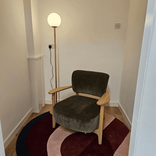 A serene meditation room in Serviced Offices - Portland Plaza, Manchester, featuring calming decor and comfortable seating for relaxation.