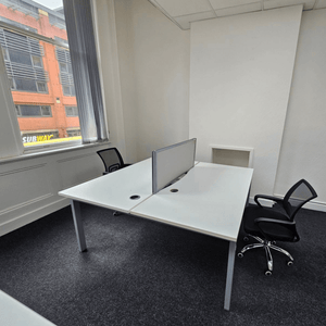 Unit 114 features five desks in a serviced office located at 109 Portland St., Manchester.