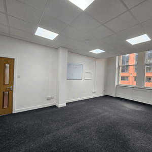 Rent Unit 114 at Method Spaces: a stylish office with 5 desks, high ceilings, and natural light on Portland Street, Manchester.
