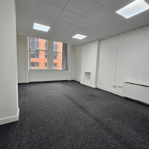 Method Spaces Unit 114 for rent: modern office with 5 desks, high ceilings, natural light, and included furniture in Manchester.