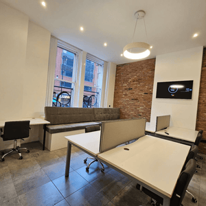 Unit G1 for rent: A stylish serviced office with 5 desks, natural light, and modern features in Manchester's Portland Street.